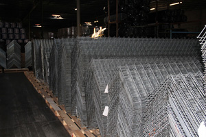 fencing material laid out on pallets in warehouse